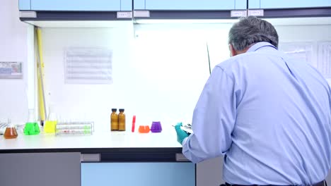 Scientists-working-in-lab-portrait.-Senior-chinese-male-scientist-working-in-lab-portrait-with-copy-space.