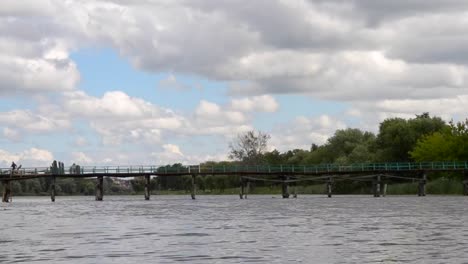 Landscape-view-of-the-sky-with-large-white-clouds-and-a-river