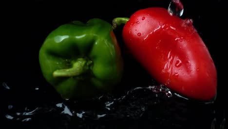 The-stream-of-water-flows-on-pepper.-Slow-motion.