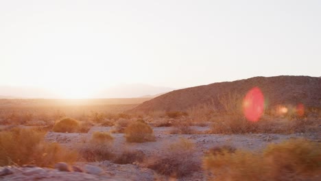 View-of-desert-landscape-from-moving-vehicle