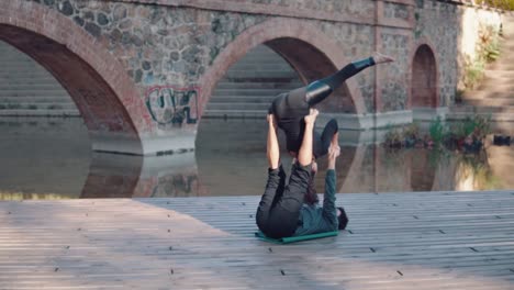 Beautiful-couple-practicing-acro-yoga-in-the-morning