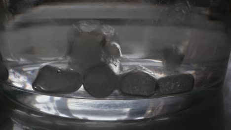 Effervescent-Tablets-Sitting-on-Glass-Bottom-and-Bubbling