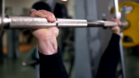 Close-up-of-the-hands-of-a-man-raising-the-barbell-4K-Slow-Mo