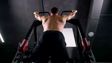 Bottom-view.-Bodybuilder-does-pull-ups-on-horizontal-bar-4K-Slow-Mo