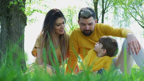 Young-family-relaxing-outdoors