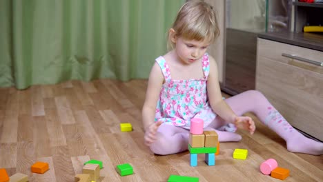 Little-girl-plays-with-a-designer.-4k