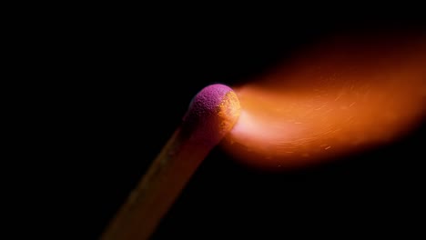 Igniting-Matches-against-Black-background,-Slow-motion-4K