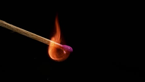 Igniting-Matches-against-Black-background,-Slow-motion-4K