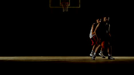 Competitors-playing-basketball-in-the-court-4k