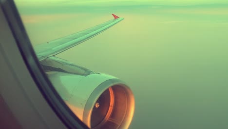 Wing-and-engine-of-airplane-flying-on-sky-and-cloud-on-beautiful-view