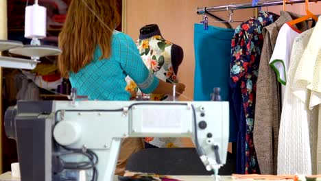 Woman-tailor-working-in-dressmaking-studio.