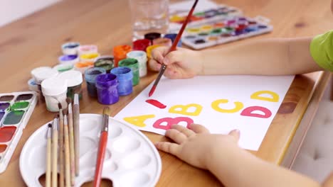 Learning-to-write-letters-on-a-white-sheet-of-paper