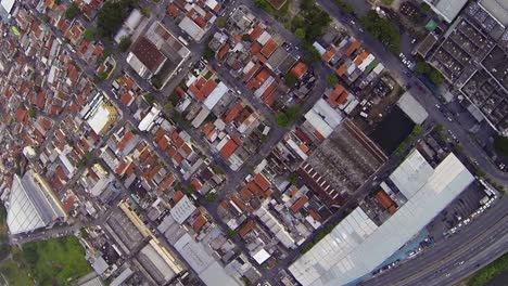 aerial-flying-over-industrial-warehouses-and-road-networks