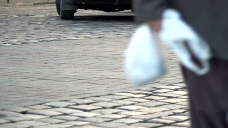 Crosswalk.-People-cross-the-street-at-a-pedestrian-crossing-in-a-big-city.-Cars-stopped-at-a-traffic-light.