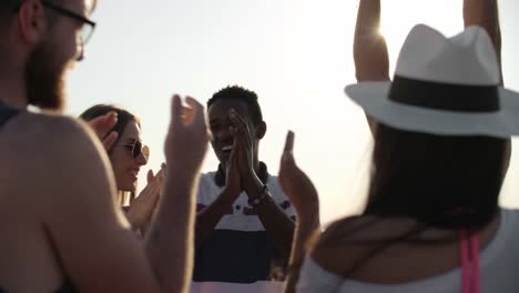 Group-of-Friends-Clapping-and-Chatting