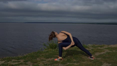 Girl-in-blue-sportswear,-yogi-practice-outdoor.