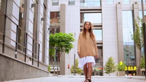 young-woman-walking-in-modern-city