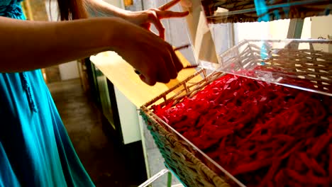 Close-up-of-woman-packing-snacks-in-supermarket-4k