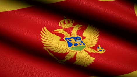 Bandera-de-Montenegro-ondeando-textil-textura-fondo.-Seamless-Loop-animación.-Pantalla-completa.-Cámara-lenta.-Vídeo-de-4-K