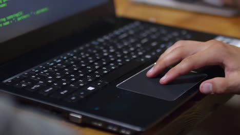 Man-Using-Laptop-Computer-Touchpad