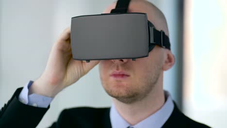 businessman-with-virtual-reality-headset-at-office