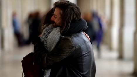 Young-couple-in-love-hugging-outdoor.