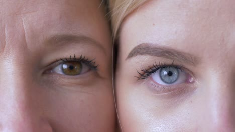 Generationenvergleich,-Augen-von-kaukasischer-Mutter-und-Tochter-nebeneinander-mit-Blick-auf-die-Kamera