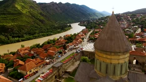 Drone-video-of-ancient-Georgian-architecture,-amazing-rooftop-view-of-city