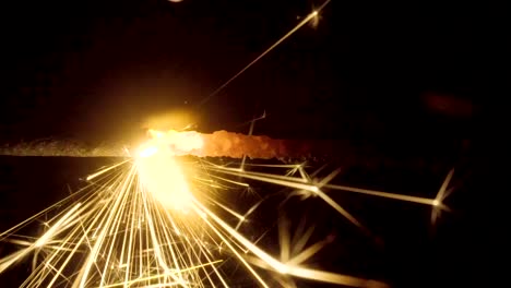 Firework-sparkler-burning-on-black-background