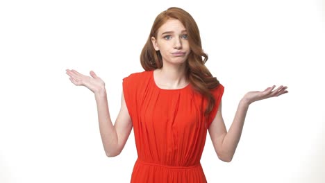 Young-beautiful-caucasian-woman-in-gorgeous-orange-dress-standing-and-say-no-isolated-over-white-background-while-looking-camera.