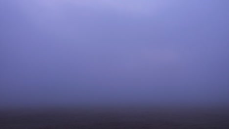 Beautiful-sunrise-over-lake,-fogy-morning.-Timelapse.