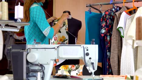 Woman-tailor-working-in-dressmaking-studio.