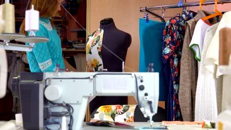 Woman-tailor-working-in-dressmaking-studio.