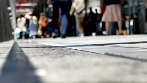 Anonymous-crowd-of-people-walking-on-walk-way-in-rush-hour-on-Osaka-station,Japan