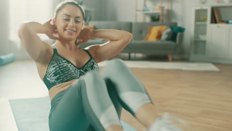 Close-Up-of-a-Strong-and-Fit-Beautiful-Girl-in-an-Athletic-Top-Doing-Crisscross-Crunch-Workout-in-Her-Bright-and-Spacious-Living-Room-with-Minimalistic-Interior.
