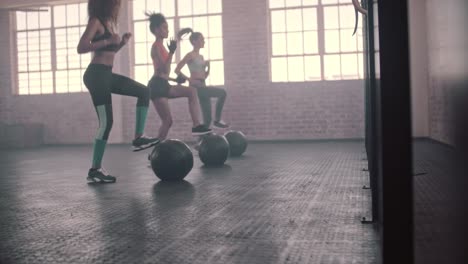 Three-females-doing-workout-together-in-gym