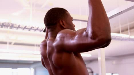 Fit-shirtless-man-doing-pull-ups