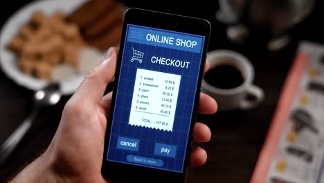 Paying-a-store-receipe-with-a-smartphone-app.-In-the-frame-of-man's-hands,-a-person-pays-for-purchases-in-an-online-store-via-Internet-and-his-smartphone.-Check-for-construction-materials-and-tools