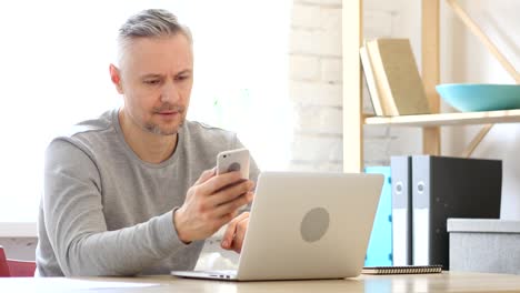 Middle-Aged-Man-Using-Smartphone,-Text-Messaging