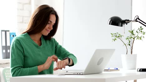 Creative-Woman-Using-Smartwatch,-Browsing