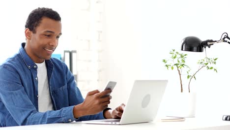Using-Smartphone,-Browsing-Afro-American-Man