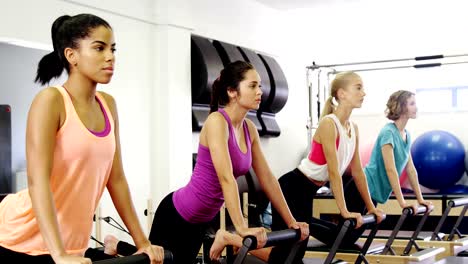 Beautiful-women-exercising-in-fitness-studio