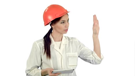 Smiling-female-engineer-with-digital-tablet-taking-to-the-camera-on-white-background