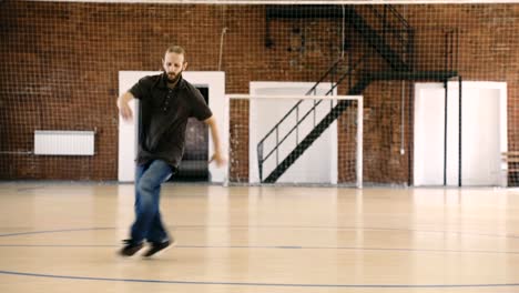 Beard-breakdancer-dancing-in-sport-gym