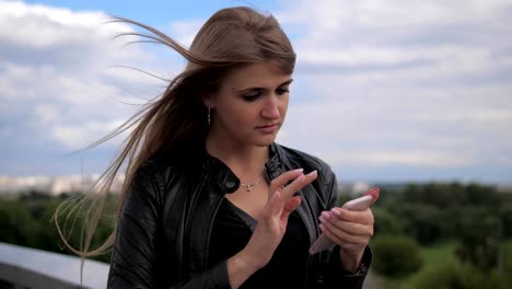 Beautiful-Woman-On-The-Street-Uses-The-Phone