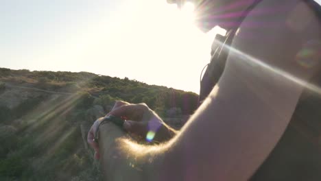 Runner-standing-on-top-of-a-cliff-on-an-island-in-front-of-the-ocean