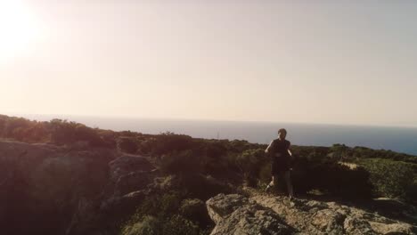 Running-man-arrives-on-top-of-a-cliff-on-an-island