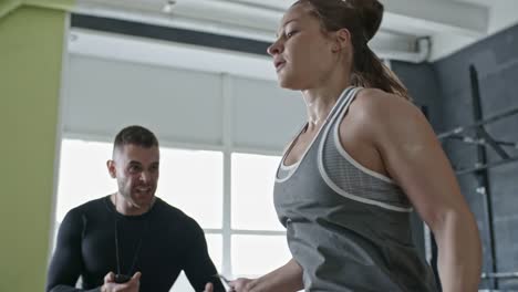 Muscular-Woman-Jumping-the-Rope-with-Personal-Coach