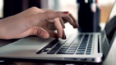 Female-fingers-type-on-a-keyboard.-Close-up-view.