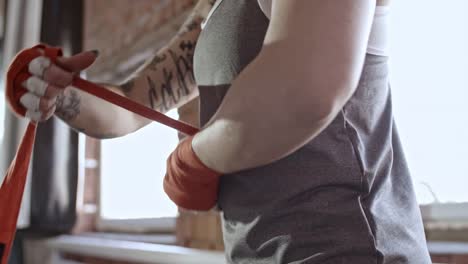 Female-Fighter-Taping-Hands